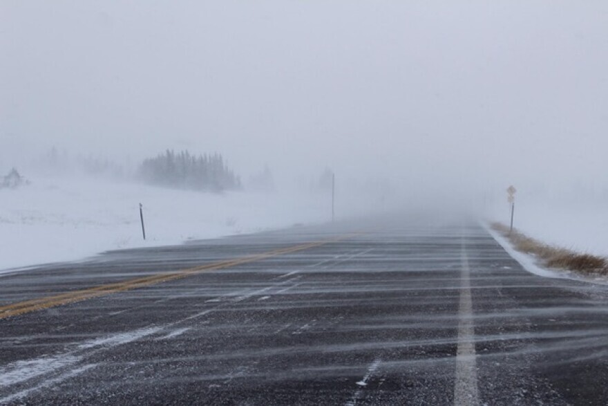 Snow blows over a road in southwest Wyoming.
