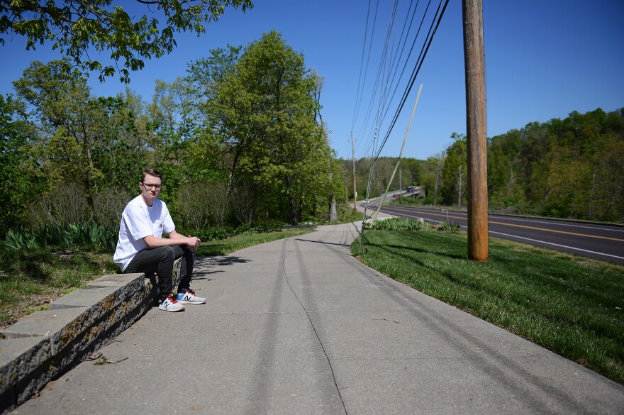 Chris Rundle poses for a portrait on Wednesday, May 3, 2023, along Old 63 in Columbia. A few months ago, Rundle called 911 in response to witnessing an opioid overdose only a few yards from where he is sitting in this photograph.