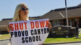 Paris Hilton protests outside the Provo Canyon School, where she says she suffered abuse as a teen, Monday, June 15, 2026, in Springville, Utah.