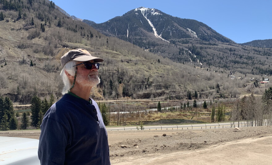 Skip Zeller leans against his truck just outside of Rico in May. He's lived in the town for 40 years. 