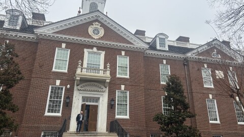 man exits front doors of legislative hall in Dover