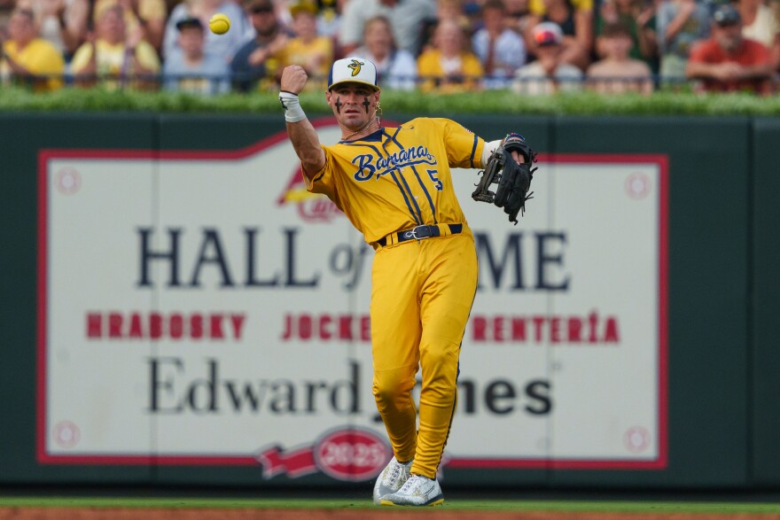 Centerfield David Meadows tosses a ball back to the infield during a baseball game between the Savannah Bananas and the Party Animals at Busch Stadium on Friday, July 18, 2025, in downtown St. Louis.