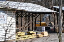 Trucks carry huge rocks behind Luzerne Lumber to fill a mine subsidence in Toby Creek.