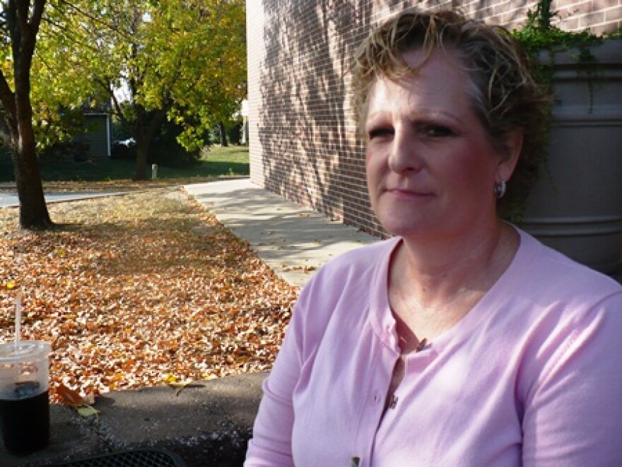 Clair Chase sits at a coffee shop in Lenexa, near the apartment where her mom used to live.