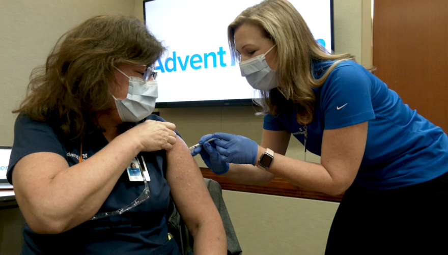 Sue Upper, nurse manager of the AdventHealth Orlando COVID unit, gets vaccinated December 16.