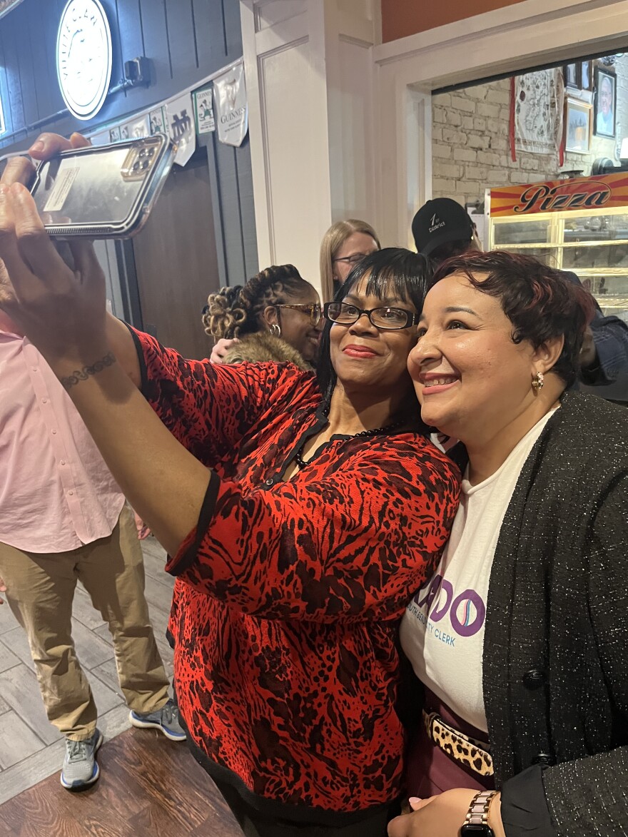 Bianca Tirado, right, poses for a selfie with a supporter Tuesday night at Corby's Pub as she celebrated her Democratic primary election win over incumbent City Clerk Dawn Jones.