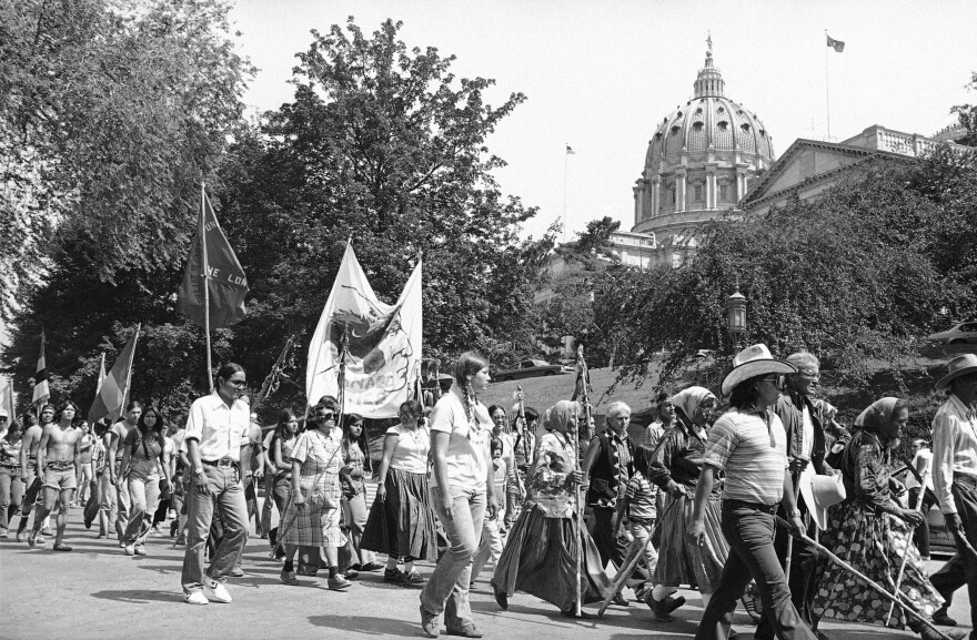 Indians taking part in the Longest Walk, which is heading for a final destination of Washington, D.C., march past the State Capitol in Harrisburg, Thursday, July 7, 1978 after reconciling with Harrisburg Mayor Tim Doutrich on remarks he made contained in a newspaper article concerning the Indians use of city property. The Indians next stop will be York, Pa.