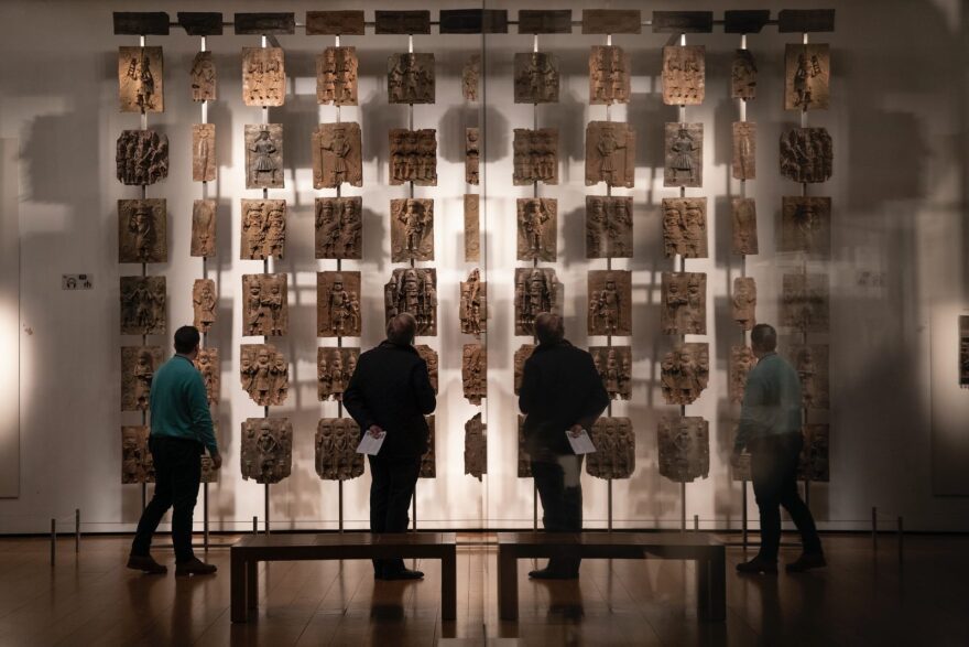 Plaques that form part of the Benin Bronzes are displayed at The British Museum in London. The Bronzes were stolen from the African country of Benin by British troops in 1897. 