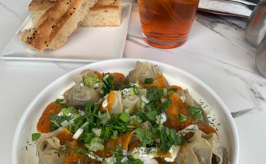 A lunch of traditional Afghan dumplings washed down with saffron green tea, using ingredients from Afghan farmers.