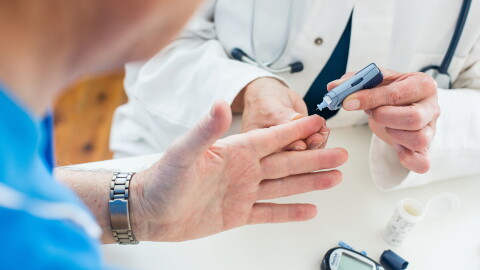  Doctor takes a sample of a patient's blood.