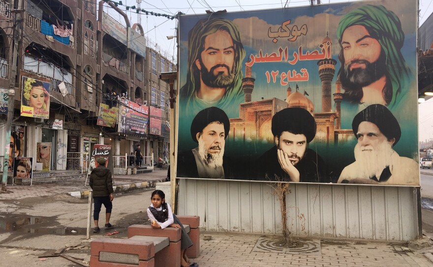 Portraits of Muqtada al-Sadr, his father and father-in-law are painted on a wall in Sadr City, a district of Baghdad. An estimated 4 million people live in Sadr City, known as Saddam City before Saddam Hussein was toppled in 2003.