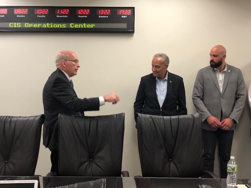 Sen. Chuck Schumer receives a briefing on election security from Center for Internet Security CEO John Gilligan in East Greenbush on Monday.