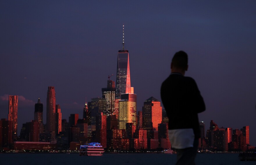 The sun sets on Lower Manhattan and One World Trade Center in New York City on Sept. 2 as seen from Hoboken, N.J.