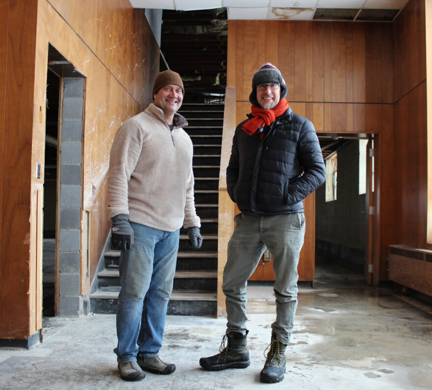 (left to right) Property co-owner Paul Migliazzo and artist Davin Watne stand inside the entry at 1328 Agnes in Kansas City, Missouri.