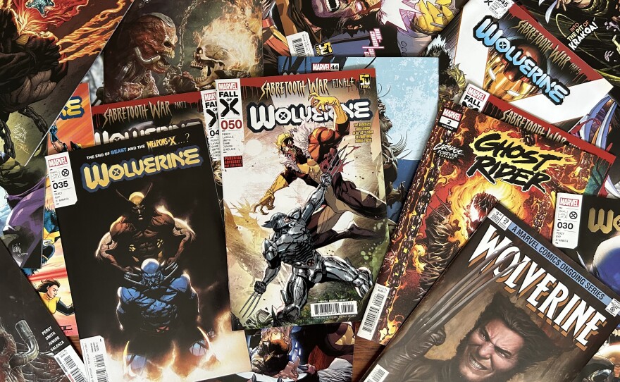 A pile of comics spread out with Wolverine, Sabretooth, and Ghost Rider on the covers