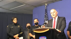 Ed Zuercher speaks at a new conference announcing the Justice Department investigation of Phoenix police on Aug. 5, 2021, along with former police Chief Jeri Williams (far left).