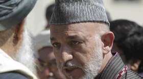 <p>Afghan President Hamid Karzai at the funeral ceremony of slain Afghanistan High Peace Council and former president Burhanuddin Rabbani on Sept. 23, 2011.Â </p>