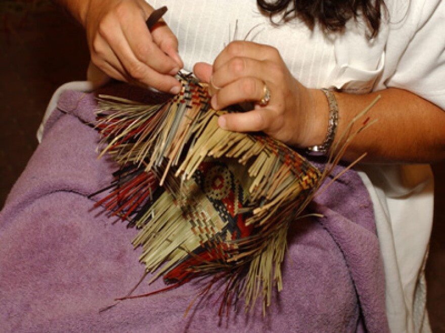 A Chitimacha basket weaving demonstration by a member of the Native American Chetimachan tribe who come from St. Mary Parish near Bayou Teche.