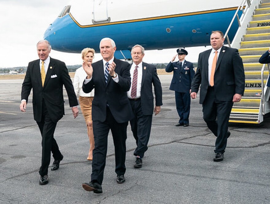 Peggy McMaster walks behind her husband, Gov. Henry McMaster (on far left), as he greets Vice President Mike Pence earlier this year.