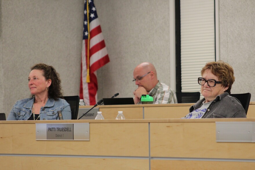 From left, Kari Dendurent, Jason Tauriainen and Patti Truesdell attend a school board meeting on Monday, June 1, 2026 in Soldotna, Alaska.