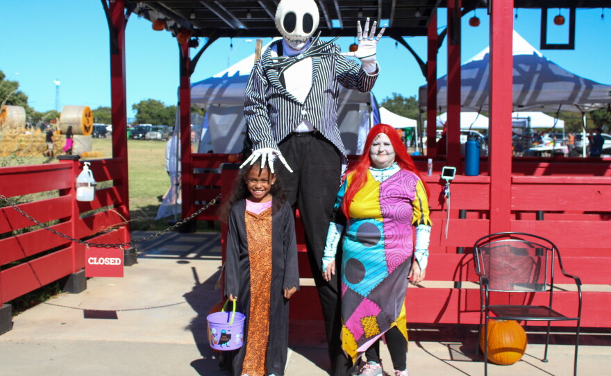 Rae'Lynn Camacho poses with Jack and Sally from "The Nightmare Before Christmas".