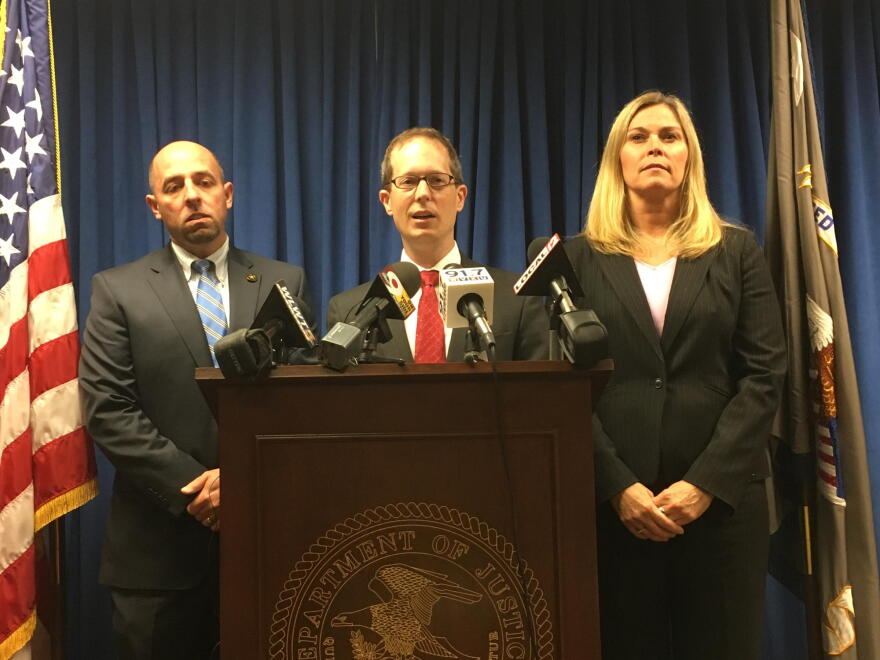 U.S. Attorney Ben Glassman (center) says there was nothing separate about this front company and Evans Landscaping controlled everything.