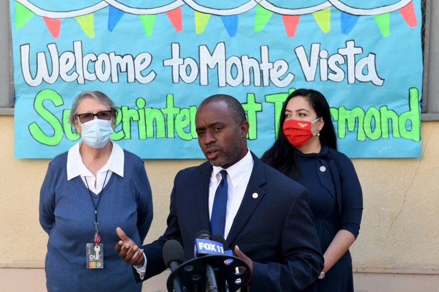 State Superintendent of Public Instruction Tony Thurmond, center, visits Monte Vista Elementary School to meet the staff working for LA’s BEST summer learning program in Los Angeles on Friday, July 23, 2021.