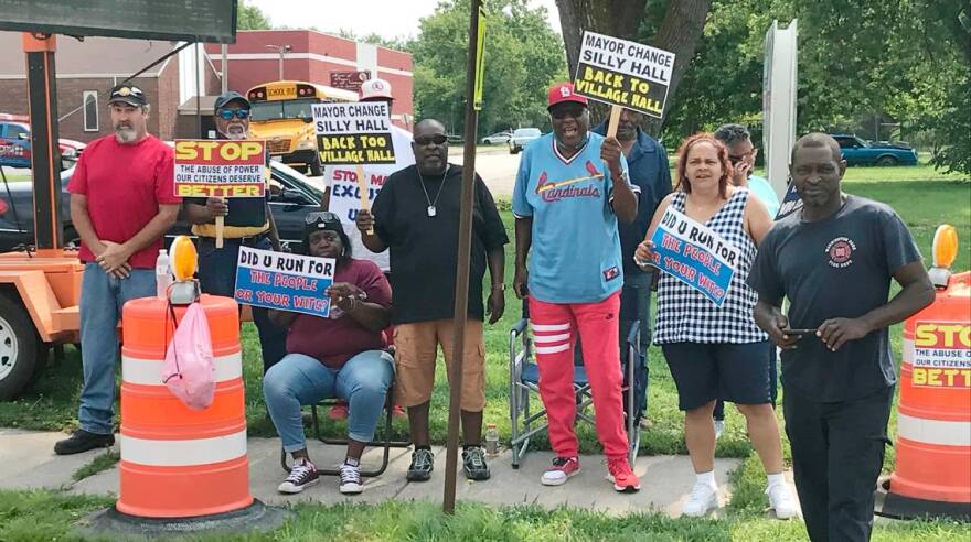 Washington Park’s Village Board trustees protest against newly-elected Mayor Leonard Moore in 2021 in Washington Park, Ill.