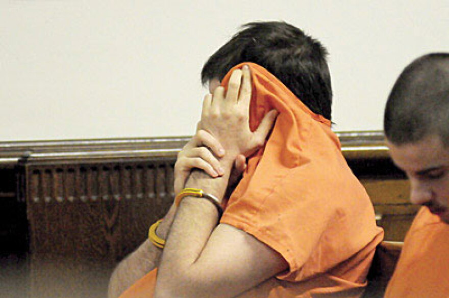 Bivens hides his face during sentencing.