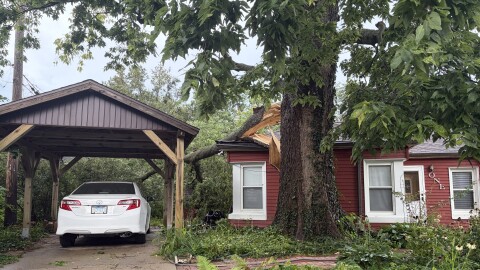 A tree fell on this house on Payne Place in Normal during Thursday's storms.