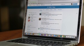 A laptop computer with the Twitter hashtag #11BillsIn11Days