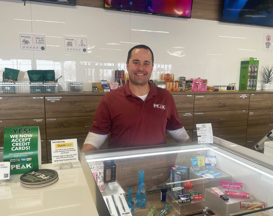 Blake Cantrell, CEO of The Peak, behind the counter at the 36th and May Avenue location in Oklahoma City.