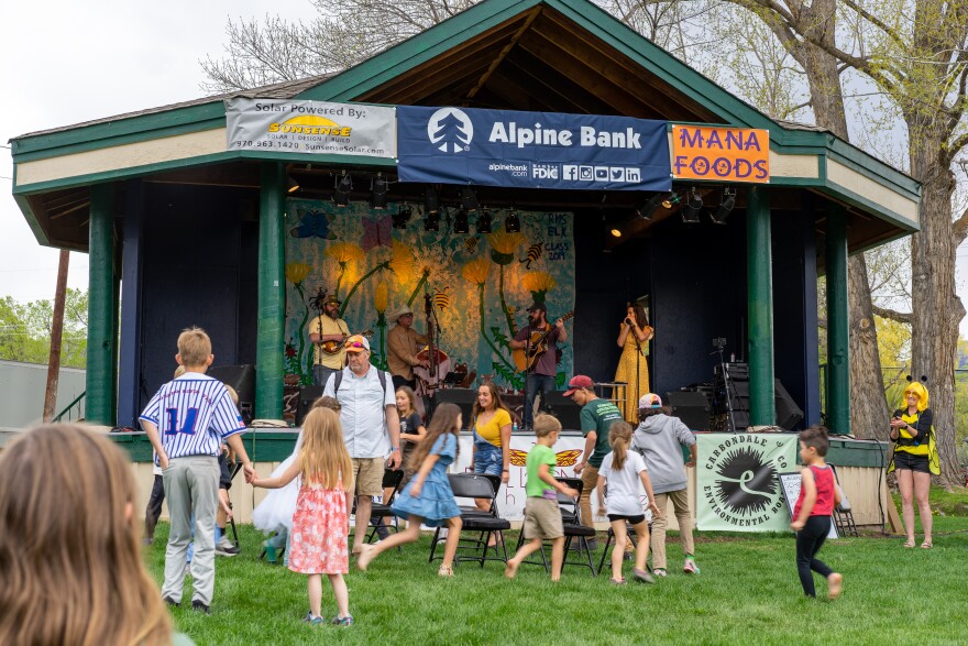 Dandelion Day attendees dance during a concert in Sopris Park. The annual celebration of community and the environment returns on Saturday, May 11, 2024.