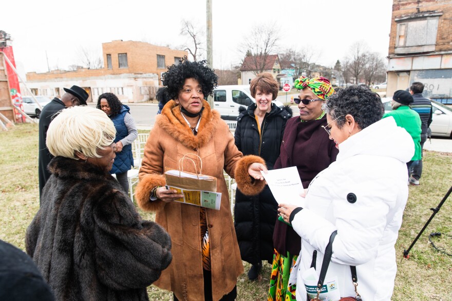 Victoria Thomas and her Jefferson Chalmers neighbors at the announcement of Detroit's plans to renovate alleyways in the city.