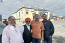 Tim Ashlock, left, manager of Buena Vista Water Storage District, joins farmer Paramjit Dosanjh, Jeevan Muhar, manager of Arvin-Edison Water Storage District and Daniel Maldonado, then assistant director of the Bakersfield Water Resources Department, at a temple dedication ceremony in March 2025.
