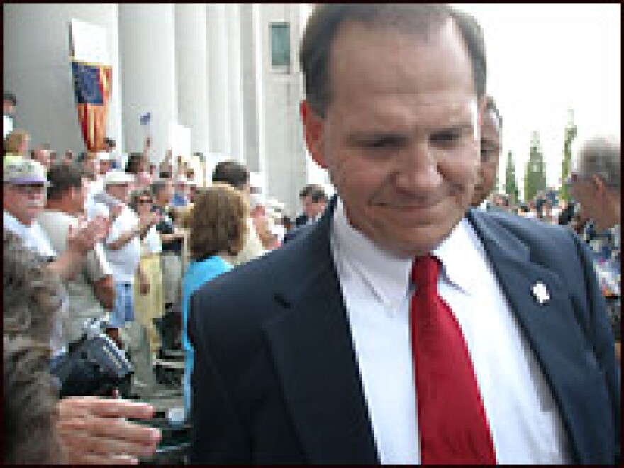 Roy Moore leaves a news conference at the Alabama State Judicial building in 2003 in Montgomery, Ala. The former "Ten Commandments" judge is challenging Gov. Bob Riley in the Republican primary.