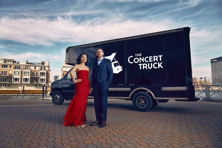 Susan Zhang (left) and Nick Luby (right) in front of The Concert Truck