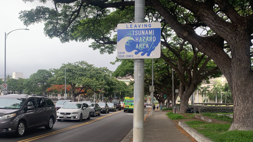 FILE - A sign indicates the border of the tsunami evacuation zone as traffic also forms in the background amid a tsunami warning. (July 29, 2025)