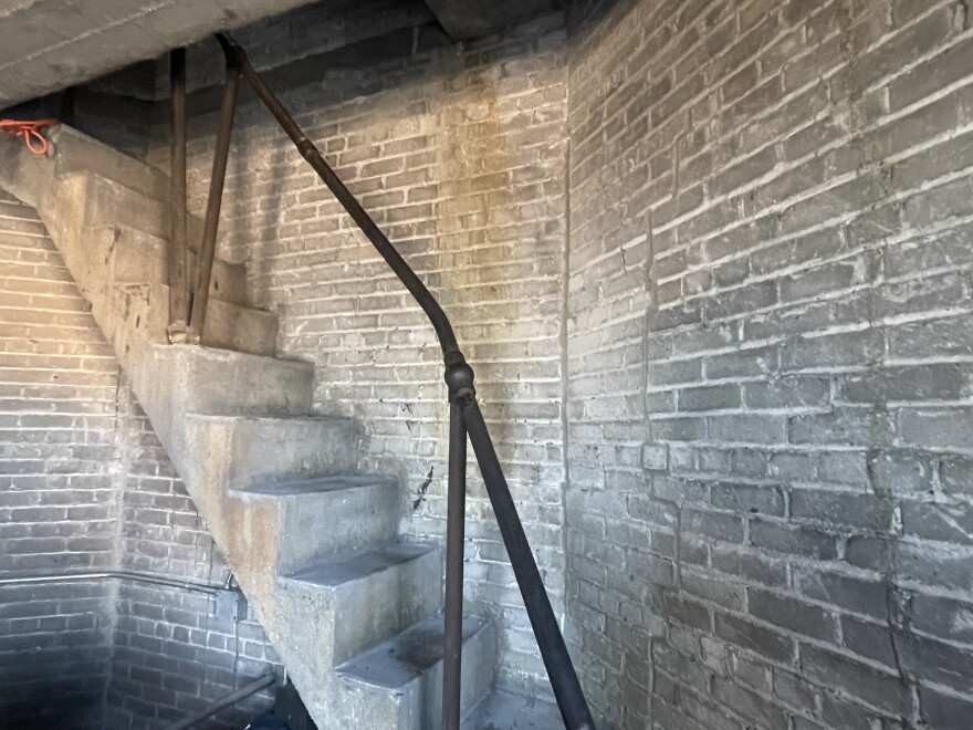The concrete staircase that leads up to the water cistern and clock access.