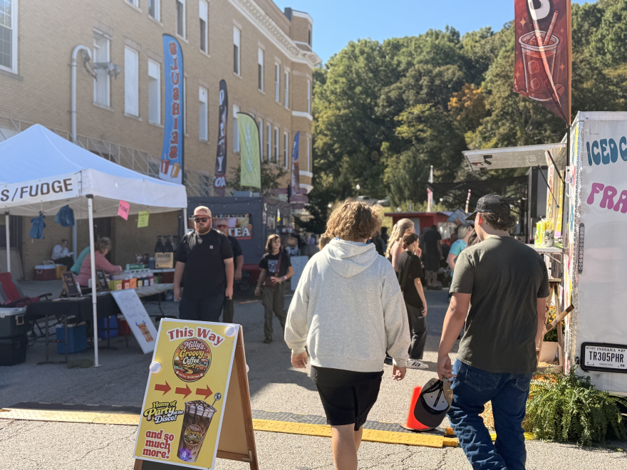 Visitors stroll past food vendors at the Orange County Pumpkin Festival Oct. 3. 