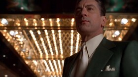 Robert DeNiro in a suit in a casino