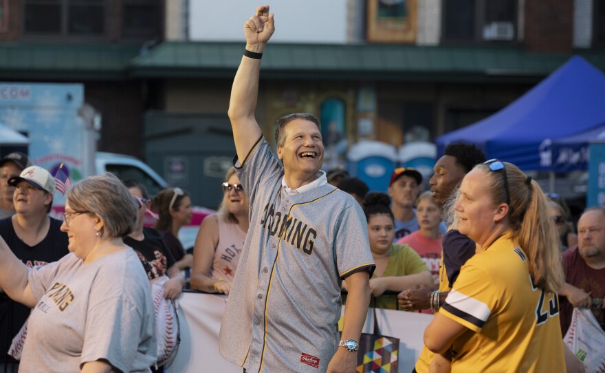 Charles Edmonds, president of Lycoming College, waves to the crowd during the Little League World Series parade.