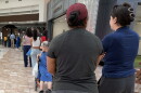 People in El Paso line up at an early voting polling place to cast their ballots in the midterm elections.