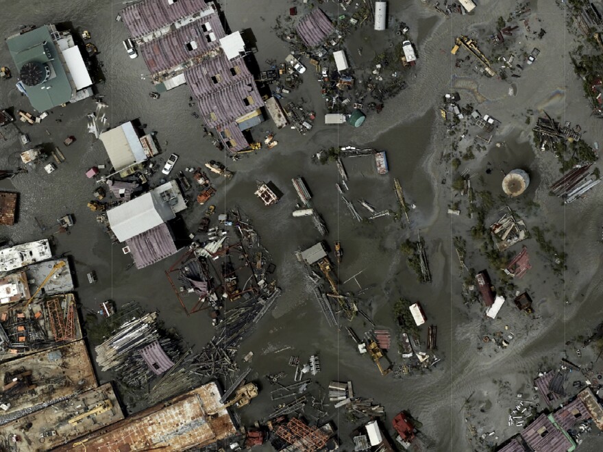 In this drone image released by NOAA, flood waters cover Tom's Marine & Salvage in Barataria, La., following the aftermath of Hurricane Ida.