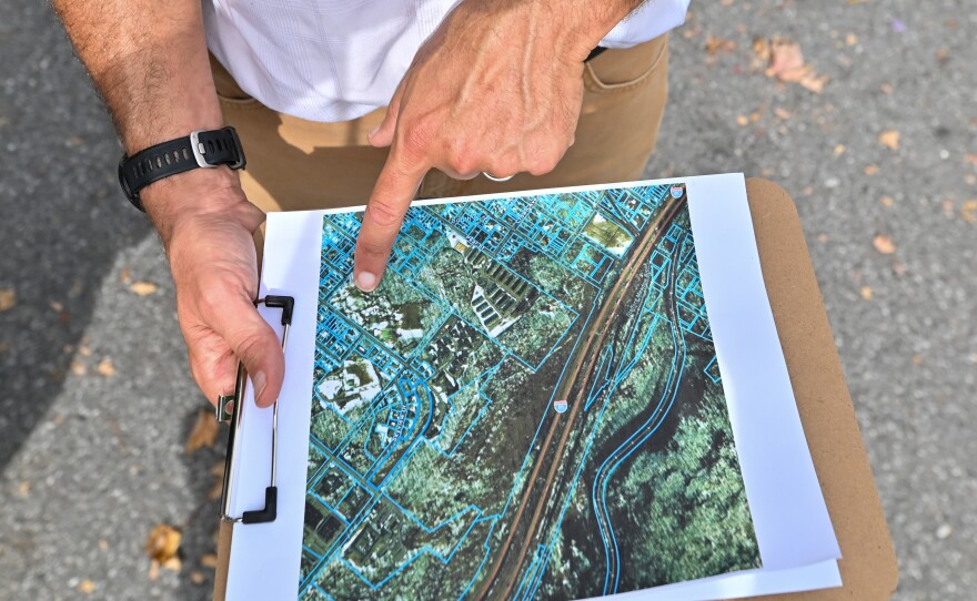 Gus Fahey points to an area in Connell Park in Scranton where a trailhead could be placed.