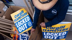 Cargill meatpacking workers gather signs at the start of their shift during a picket Wednesday, July 22, 2026, in Fort Morgan. The company has locked out its workers and shuttered the plant as Teamsters Local 455 fights for a new contract.