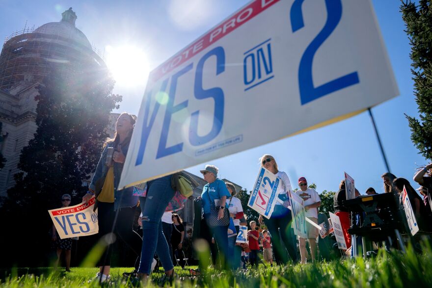 Attendees march during a rally encouraging voters to vote yes on Amendment 2, which would add a permanent abortion ban to Kentucky's state constitution at the state Capitol in Frankfort, Kentucky, on October 1, 2022.