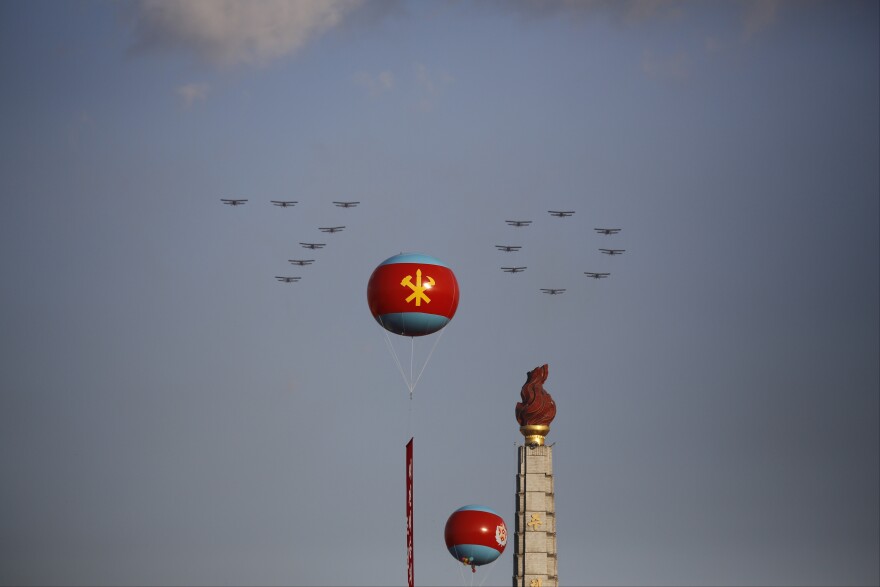 Planes fly in a "70" formation over the Juche Tower during a parade on the Kim Il Sung Square, on Saturday in Pyongyang, North Korea, during a lavish military parade to mark the 70th anniversary of the North's ruling party.