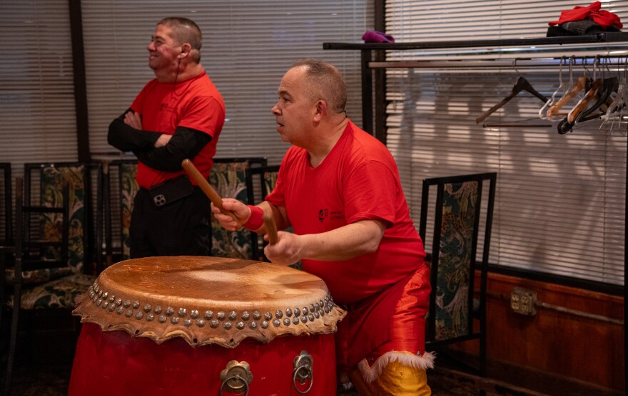 George Kwan takes his turn on the drum.