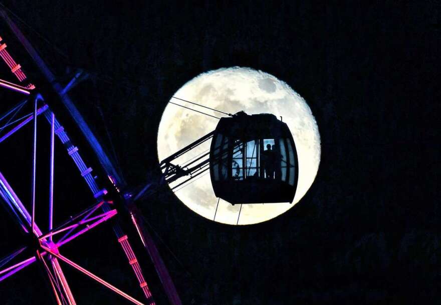 This photo of the Orlando Eye and a full moon is one of many taken by Red Huber over the last 45 years./Photo: Red Huber